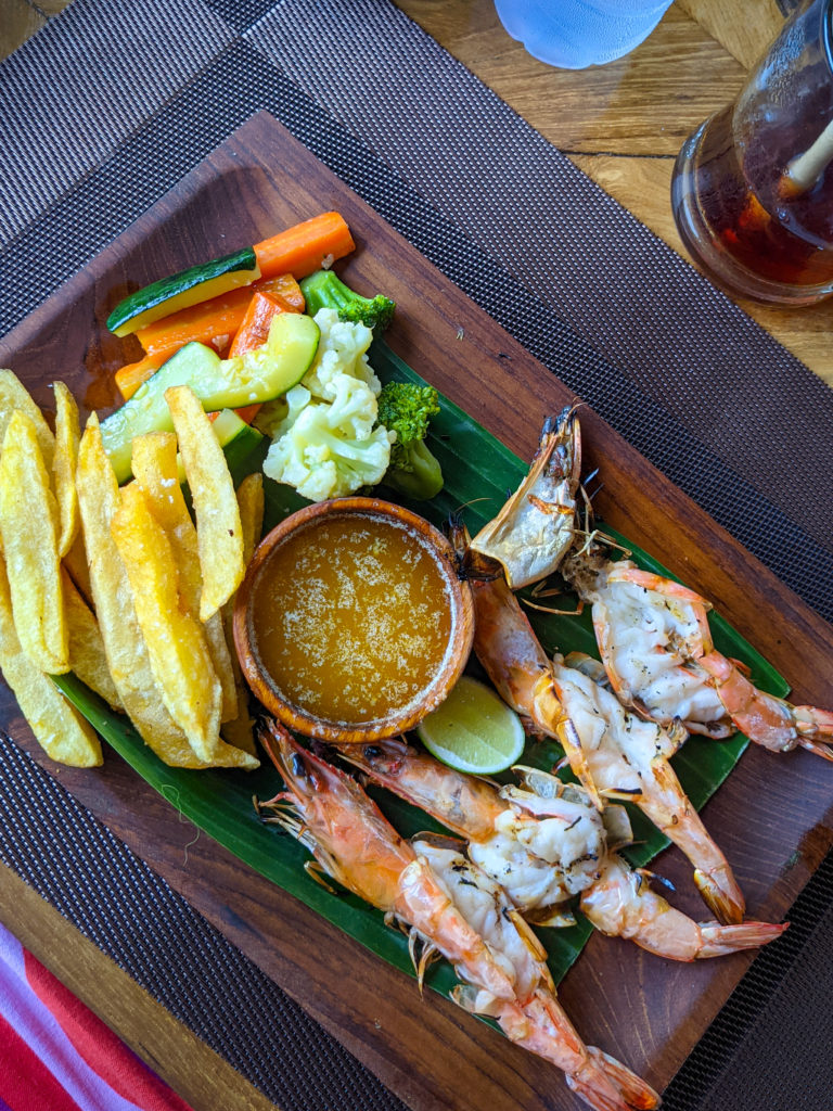 Butterfly prawns on a wooden tray